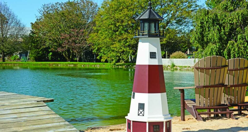 A five foot tall poly lighthouse. White with Red and black accents.