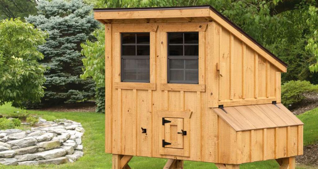 small chicken coop with two windows and a small door