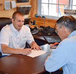 two men discussing a blueprint
