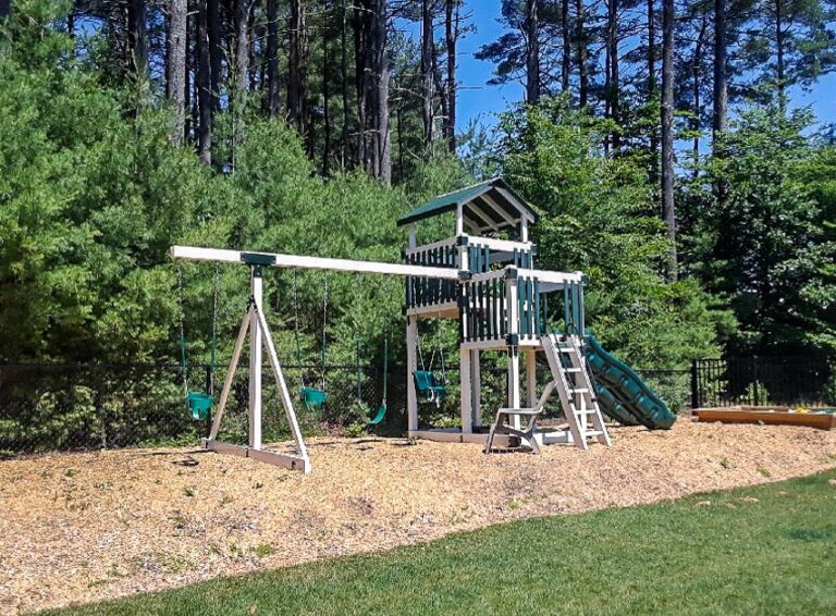 Sierra Maintenance Free Vinyl Playset with Swings, Slides, and Activity Centers