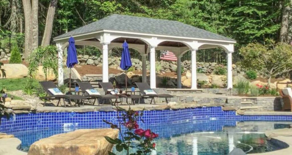 A 14x26 foot vinyl pavilion by a beautiful pool