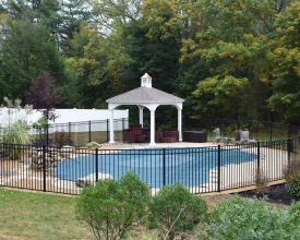 Small poolside pavilion with cupola accent, durable vinyl construction, and shingle roof
