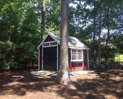 prebuilt 10x12 shed with red siding and transom windows