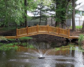 Wooden backyard bridge for pond