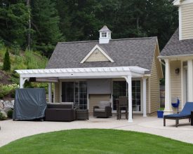 This pool house has it all with pergola on the front and fully finished interior complete with bathroom, loft, and living area.