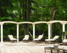 This pergola is personalized featuring arched tops and a unique design.