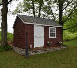This 12x14 backyard shed is personalized with paint of choice and all wood doors and is on a crushed stone base.