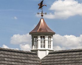 Weathervane and cupola octagon design with polished copper roof and windows.