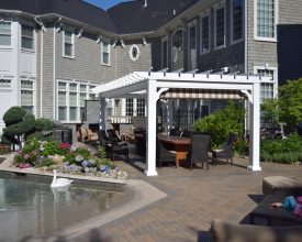 Vinyl stand alone pergola adds the perfect touch to the this backyard pool area, plus with the EZ shade makes perfect place for outdoor dining.