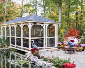Gazebo featuring removable screens, and white vinyl construction, and gray shingled roof.