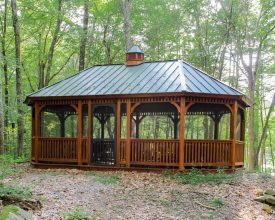 Large gazebo octagon oval shape with metal roof, stained cedar wood, make this gazebo stand out anywhere.