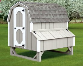 Chicken Coop is designed to look like a barn, with gambrel roof and nesting boxes on the side.