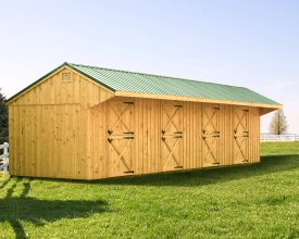 Horse Barn featuring a metal salt box roof design, cedar vertical siding, and four stalls.