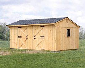 This horse barn features 2 stalls, cedar vertical siding, and shingle roof.