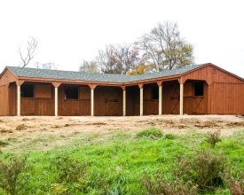 Horse Barn has lots of room, cedar siding exterior, shingled gable roof and a custom (L) shape design.
