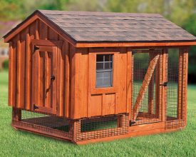 Chicken Coop is built with stained cedar siding and features a open air run area.