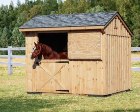 This small 1 horse barn features dutch style door, shingle roof, and cedar exterior.