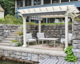 This backyard pergola is complete vinyl construction with an ez shade.