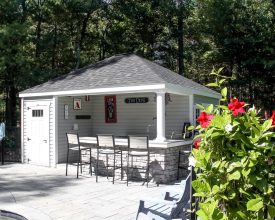 Personalized pool house with outside bar, storage room, and electrical package.
