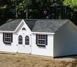 This 12x26 personalized shed features custom windows and doors, vinyl siding & trim, and victorian style dormer.