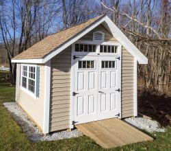 This 10x12 custom shed has ramp for lawn equipment, double door on the end and custom window selection.
