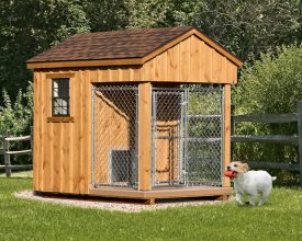 Small dog kennel cedar board batten exterior, with shingle roof, and chainlink open run area.