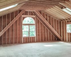 This amazing garage has double full width dormers, with a full second story, & plenty of windows.