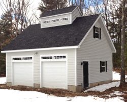 Beautiful 2 car garage with loft area, and personalized cupola with transom windows.