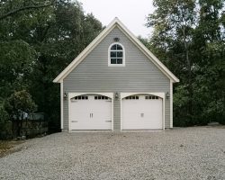 This amazing 2 car garage, features, carriage house garage doors, arched-top windows & second story.