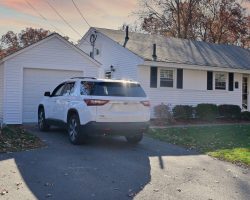 One car garage matches home exterior