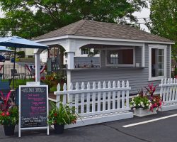 Parking lot view of Swan 10x18 Pool House