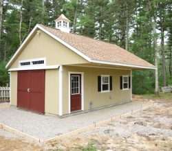 Custom 14x24 outdoor storage shed featuring duratemp exterior siding, a sliding double barn door, transom windows, roof overhang, and a vinyl cupola!