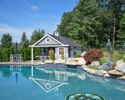 pool house with stone front